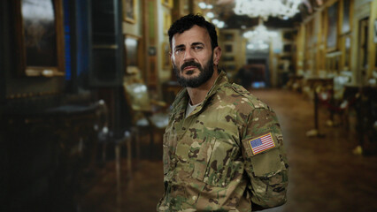 Hispanic man in military uniform with beard stands confidently in art gallery exhibiting cultural...