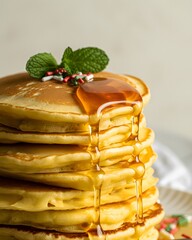  Delicious Stack of Fluffy Pancakes Drenched in Golden Maple Syrup with Festive Red and Green Sprinkles, Isolated on a White Background for Breakfast, Brunch, or Holiday Food Concepts