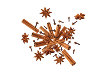 Aromatic Warm Spices Scattering: Cinnamon Sticks, Star Anise, and Cloves Isolated on White Background