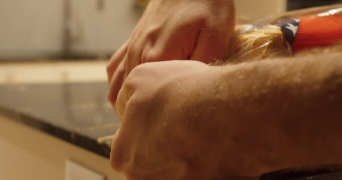 A loaf of toast bread is sealed airtight in its plastic bag in a kitchen, showing how to keep food fresh and prevent mold or spoilage.