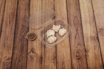  Fried gyozas filled with enoki mushrooms, Japanese leek, and bamboo shoots, with ponzu and daikon sauce