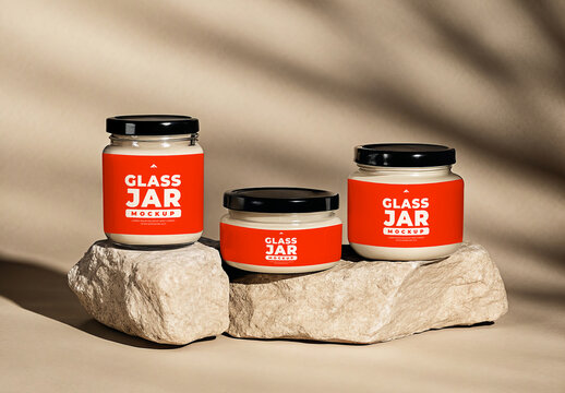 Set of Three Glass Jars Mockups for Food or Cosmetic Products on Natural Rocks