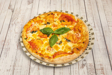Spring pizza with wild asparagus, fresh peas, sliced ​​zucchini, and fresh mint on a crust