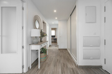 Functional entryway with a locker for each family member, a shoe rack, and a full-length sliding mirror