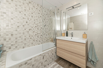 Contemporary bathroom with hexagonal wall tiles, a floor-standing shower tray, and German-designed built-in faucets