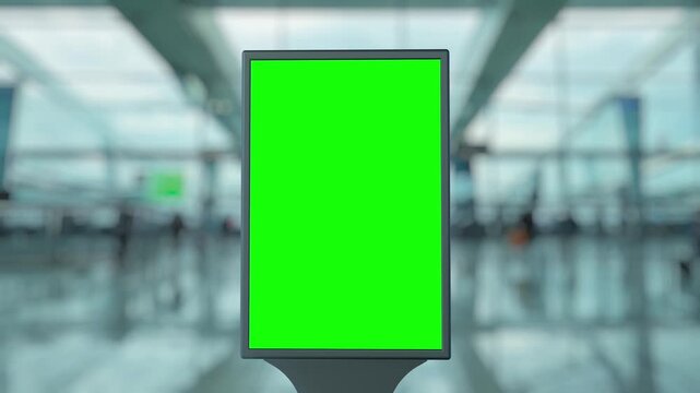 Timelapse showcasing a blank green screen billboard in a bustling airport terminal, with blurred passengers moving through the space, highlights the dynamic atmosphere of travel
