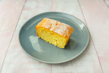 Vanilla and raspberry sponge cake with alternating layers of raspberry cream, decorated with fresh raspberries and melted white chocolate