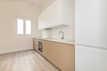 Urban-style kitchen with polished concrete walls, open metal shelving, and smart appliances