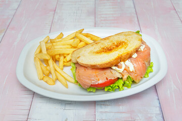 Grilled salmon sandwich: with avocado, arugula, and dill aioli on rye bread