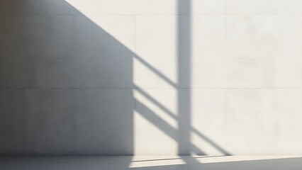 Obraz premium Minimalist concrete wall with geometric shadows and smooth texture in a studio setting.