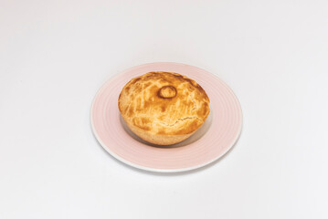 freshly baked Argentine empanadas filled with knife-cut meat, raisins, and olives, accompanied by homemade chimichurri.