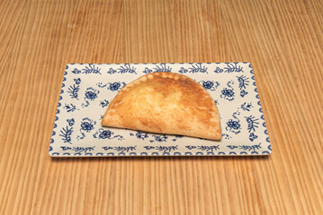 Artichoke and ham empanadas, delicate pastry, served with lemon and dill vinaigrette