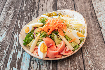 salad with canned tuna, chopped tomato, caramelized onion, and green pepper, dressed with a honey and mustard vinaigrette