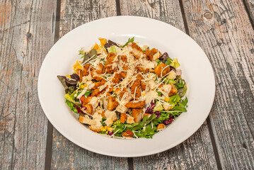 Avocado salad stuffed with canned tuna, mayonnaise, chopped celery, and chives, served on iceberg lettuce with sprouts