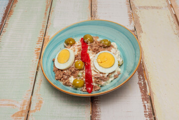 Baby squid Russian salad with potato, green pepper, and red onion, tossed with La Vera paprika mayonnaise