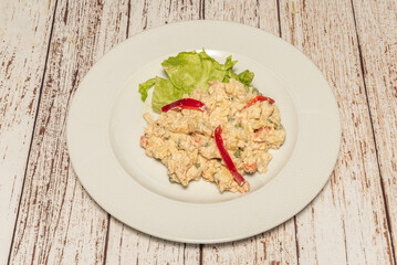 Light Russian salad with potatoes, green beans, and carrots, dressed with Greek yogurt and Dijon mustard, served on lettuce