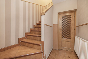   staircase   and wrought iron handrail with gold details