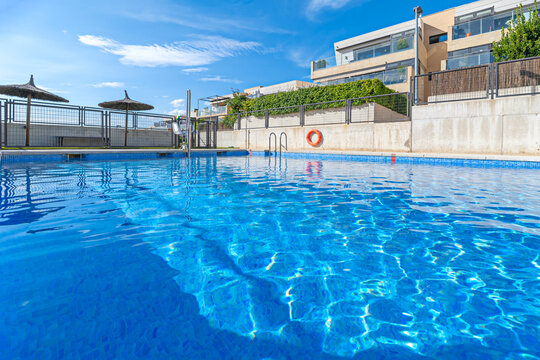 Community pool with an integrated architectural design that appears to float above the city's cityscape