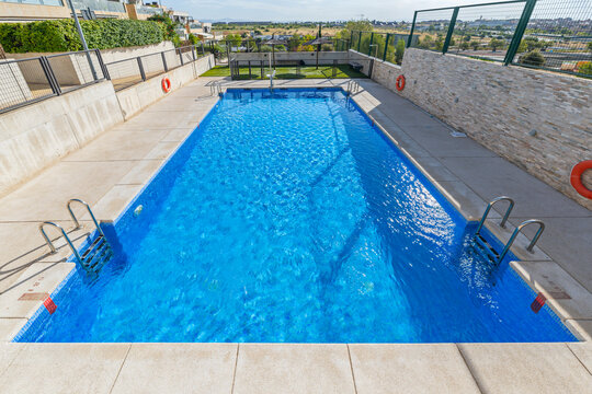 Pool complex with towel service, premium sun loungers, and designer umbrellas