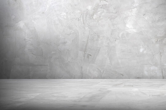 Minimal Gray Concrete Wall and Floor Texture Background, A smooth gray concrete wall with a matching concrete floor, creating a minimalist industrial background.
