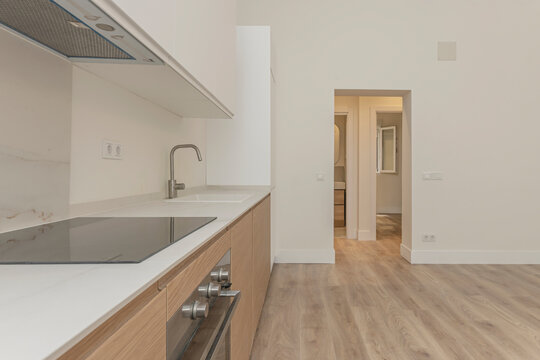 Contemporary kitchen with graphite gray cabinetry, Silestone countertops, and  faucets for an elegant touch