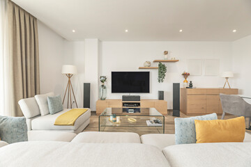 modern style: linen sofa, log coffee table, and dining room with reclaimed wood table