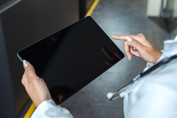 Doctor using tablet for medical data. Modern healthcare technology and telemedicine concept.