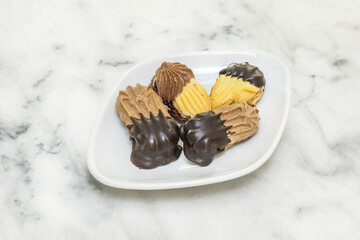 Healthy tea pastries with sugar-free oatmeal cookies, date and walnut bars, and whole-wheat muffins with dark chocolate chips