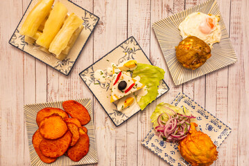 Causa Limeña in a clear glass showing its layers: yellow potato, tuna filling, avocado, and aji amarillo cream