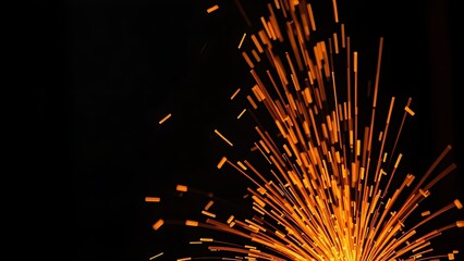 Bright orange sparks fly dynamically against a dark backdrop, evoking industrial metalwork energy.