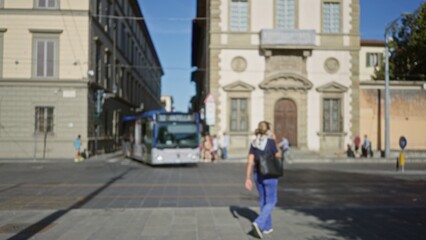 City street scene with soft defocused buildings, bus and distant doorway in blurry bokeh street; background backplate copyspace calm.