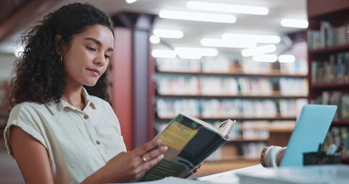 Student, textbook and reading in library with woman for education, assignment or thesis on college campus. Laptop, tech and female person with knowledge, preparation for exam or research for paper