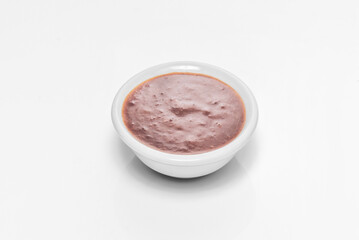 Mini pots with maple barbecue sauce, showing its deep mahogany hue and slightly thick consistency