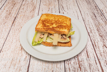 Tuna Sandwich: canned tuna in olive oil, homemade mayonnaise, and pickles on bread Whole wheat