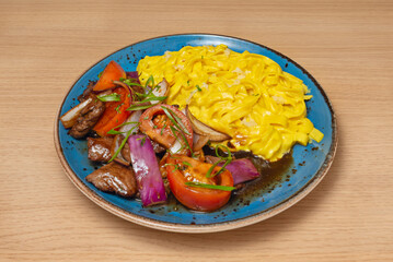Vegetarian sautéed noodles with golden tofu, sautéed mushrooms, broccoli, and julienned carrots, maintaining the umami flavor of soy sauce and garlic