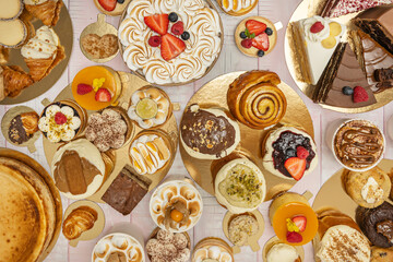 Dulce de leche tres leches cake with generous layers of  dulce de leche between the sponge cake and garnished with golden meringue