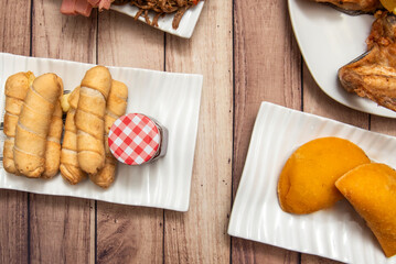 Chicken fingers with toasted ground corn breading and Creole spices, fried in very hot oil until evenly golden and crispy