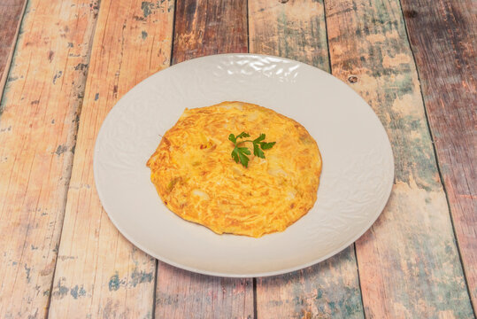Bodega-style potato omelet, juicier than usual and with generous chunks of visibly tender potato