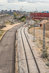 Obraz premium Elevated section of commuter rail track on concrete pillars, with an acoustic damping system to reduce noise in an urban area