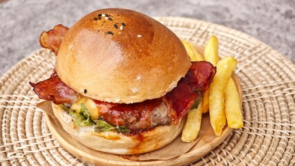 BBQ pork burger with cheese and bacon.