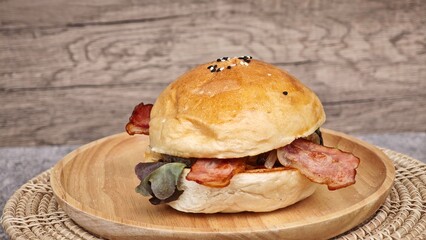 BBQ pork burger with cheese and bacon.