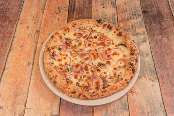 Anchovy Pizza with anchovy fillets, black olives, capers, and dried oregano on tomato sauce