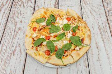 Eggplant pizza with roasted eggplant, sun-dried tomatoes, fresh basil, and grated pecorino cheese