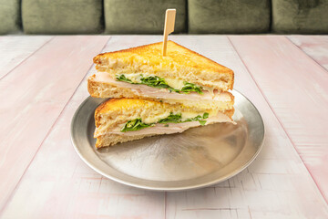 Classic chopped hard-boiled egg sandwich with mayonnaise and mustard on crustless white bread