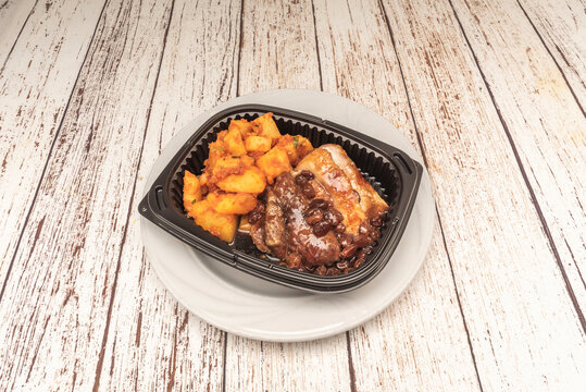 Acorn-fed Iberian pork tenderloin grilled over oak charcoal, diced and served with Canarian mojo pic&oacute;n sauce and wrinkled potatoes