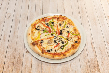  Italian Vegetarian pizza with roasted peppers, grilled eggplant, caramelized onions, and fresh spinach on a whole-wheat crust