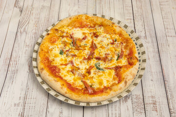 pizza with tuna belly, piquillo peppers, roasted onions, and Aragon black olives