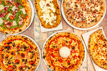 Basil Pesto Pizza with homemade pesto, buffalo mozzarella, and yellow cherry tomatoes