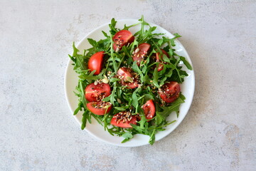 Fresh Arugula and Cherry Tomato Salad with Seeds top view cut out