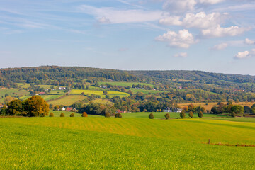 Fototapeta premium Autumn landscape, Terrain hilly countryside in Zuid-Limburg with small houses hidden on hillside, farmland and forest, Epen is a village in southern part of the Dutch province of Limburg, Netherlands.